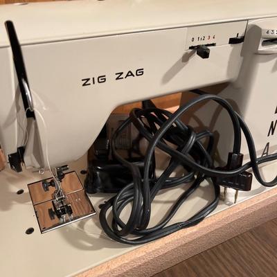 Vintage Necchi Elna portable sewing machine with stand