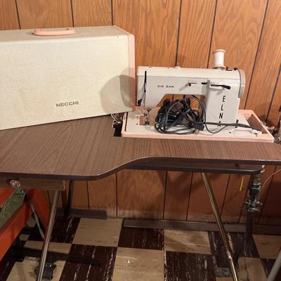 Vintage Necchi Elna portable sewing machine with stand