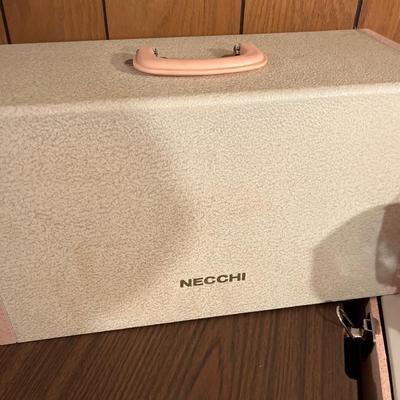 Vintage Necchi Elna portable sewing machine with stand
