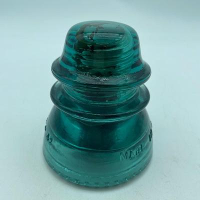 Large teal glass insulator