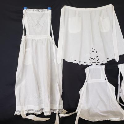 Four White Aprons and Two Handmade Brooms (D-KD)