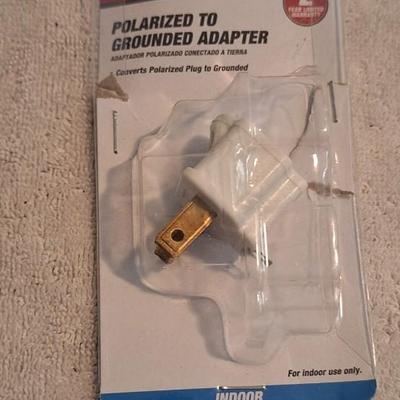 Polarized to grounded adapter