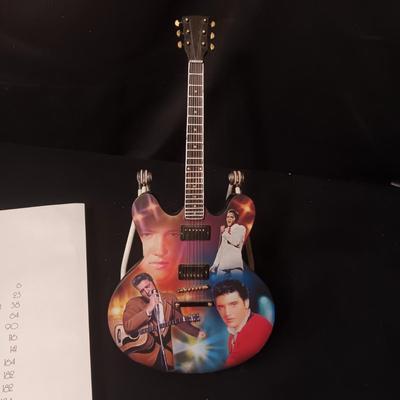 ELVIS COFFEE TABLE BOOK AND A LEGEND IN LIGHTS GUITAR