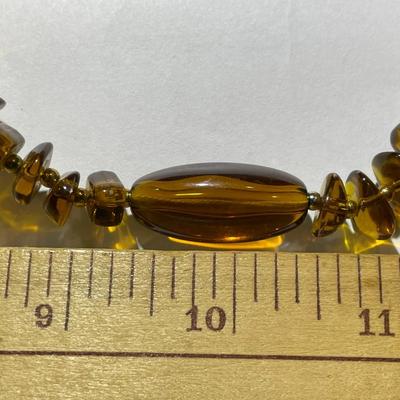Vintage Mid-Century Amber Color Resin/Lucite Necklace 30" Long in Good Preowned Condition.