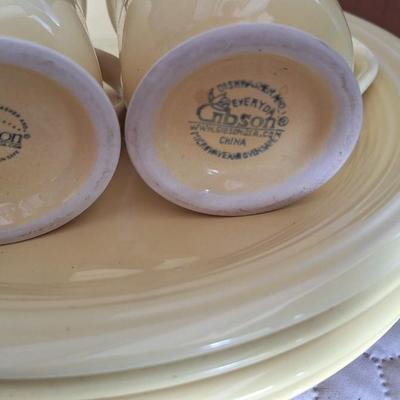 Gibson dishes set service for four yellow