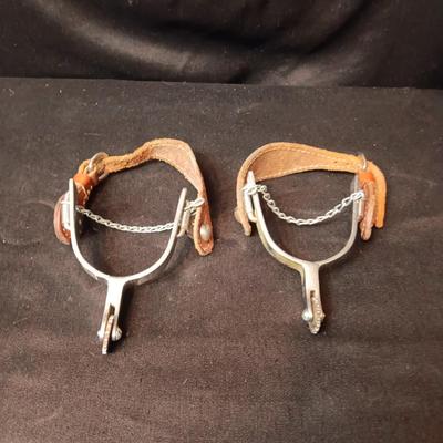 PAIR OF SPURS WITH LEATHER TOOLED STRAP
