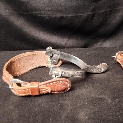 PAIR OF SPURS WITH LEATHER TOOLED STRAP