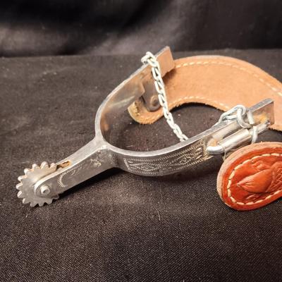 PAIR OF SPURS WITH LEATHER TOOLED STRAP