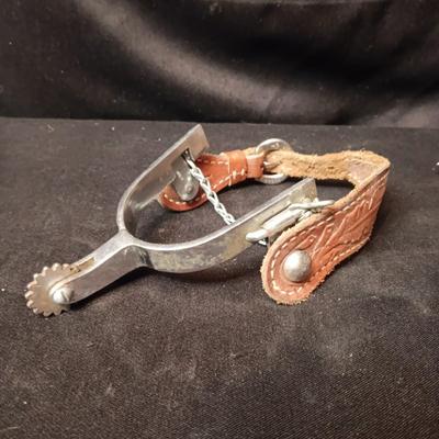 PAIR OF SPURS WITH LEATHER TOOLED STRAP