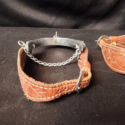 PAIR OF SPURS WITH LEATHER TOOLED STRAP