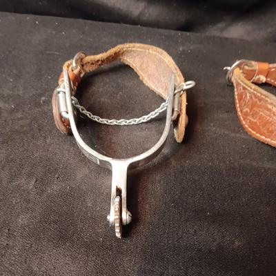 PAIR OF SPURS WITH LEATHER TOOLED STRAP