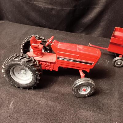 INTERNATIONAL METAL TOY TRACTOR AND ERTL CART