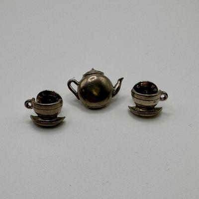 Four-Piece Latware Designs Set with Sterling Pins & More (K-DZ)