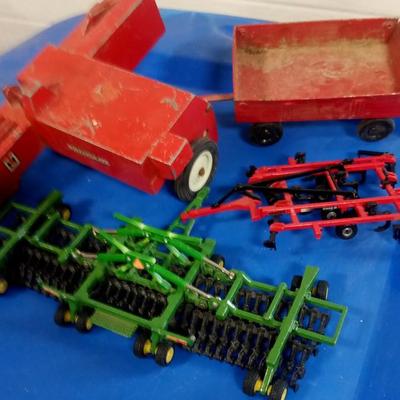 LOT 175 FOUR TOY PIECES OF FARM EQUIPMENT