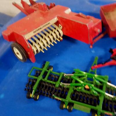 LOT 175 FOUR TOY PIECES OF FARM EQUIPMENT