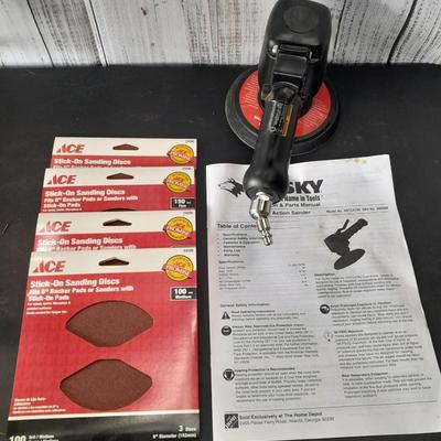 Brand new Husky 6" Dual Action Sander with instructions and brand-new sanding discs