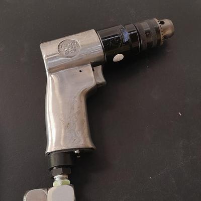 like new - Central Pneumatic 3/8" Reversible air drill with instruction book