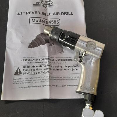 like new - Central Pneumatic 3/8" Reversible air drill with instruction book