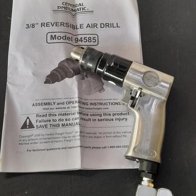 like new - Central Pneumatic 3/8" Reversible air drill with instruction book