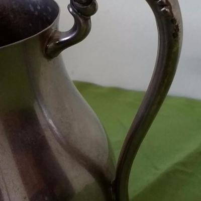 Vintage claw foot silver water pitcher with ice catcher, by F B Rogers 