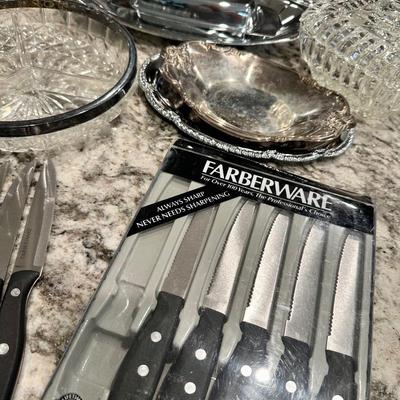 Lot of steak knives and glass and silver-plate dishes
