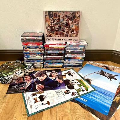 Lot of DVDs (all included in photo) also movie posters and a stuffed turtle