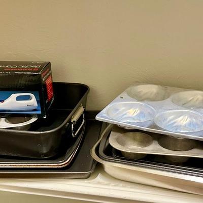 Lot of Bakeware including cake pans, cookie sheets and an electric knife (like new)