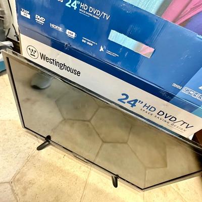 24" Westinghouse TV (like new) and 2 cardboard cut outs of Johnny Depp and Frozen over 6ft.
