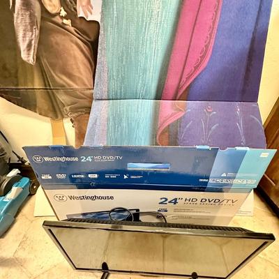 24" Westinghouse TV (like new) and 2 cardboard cut outs of Johnny Depp and Frozen over 6ft.