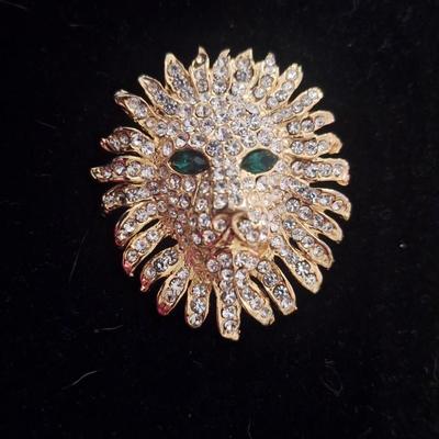 Vintage brooch lion head with rhinestones and green stone eyes