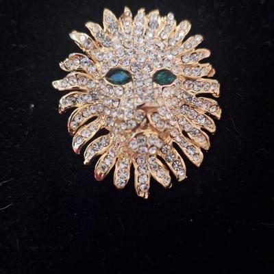 Vintage brooch lion head with rhinestones and green stone eyes