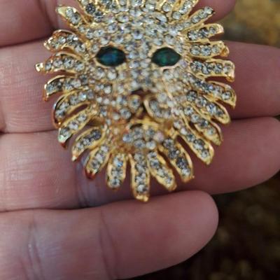 Vintage brooch lion head with rhinestones and green stone eyes