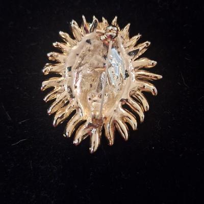 Vintage brooch lion head with rhinestones and green stone eyes