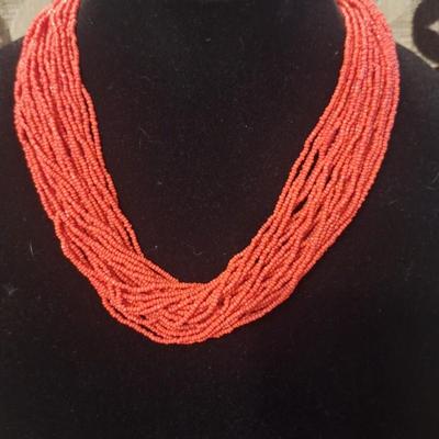 Red seed coral necklace approximately 19 in long
