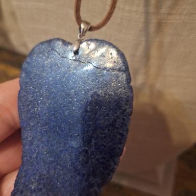 Blue stone carved leaf pendant on leather strap necklace