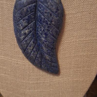 Blue stone carved leaf pendant on leather strap necklace