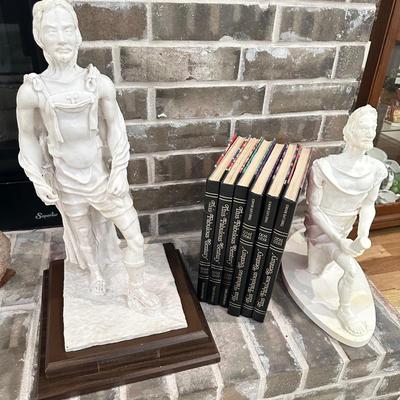 2 Statues and a set of Books