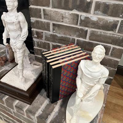 2 Statues and a set of Books