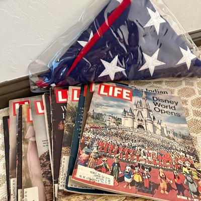 A Stack of Vintage LIFE Magazines and an American Flag