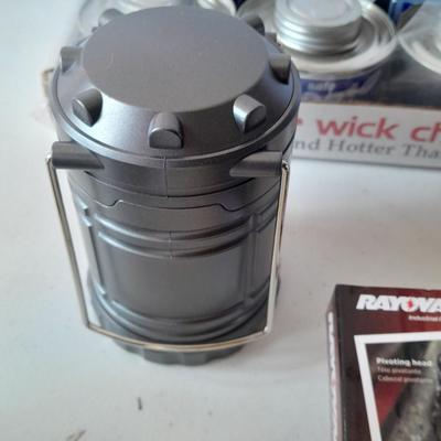 Camping or Prepping items - Rayovac headlamp - 12 cans of cooking fuel - and a LED Lantern