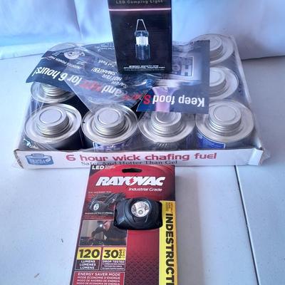 Camping or Prepping items - Rayovac headlamp - 12 cans of cooking fuel - and a LED Lantern