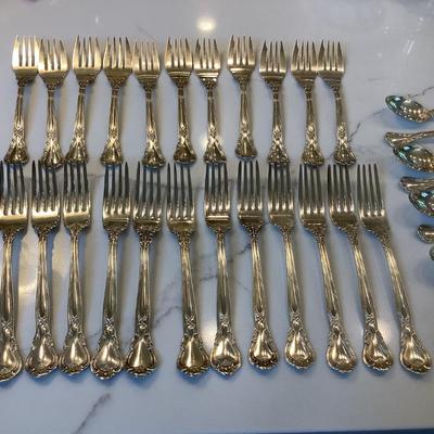 Silver- Essentials in Silver, 10 dinner knives, 12 forks, 10 spoons, 10 salad forks, 11 soup spoons