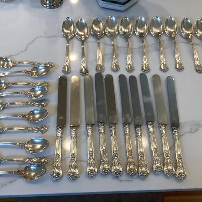 Silver- Essentials in Silver, 10 dinner knives, 12 forks, 10 spoons, 10 salad forks, 11 soup spoons