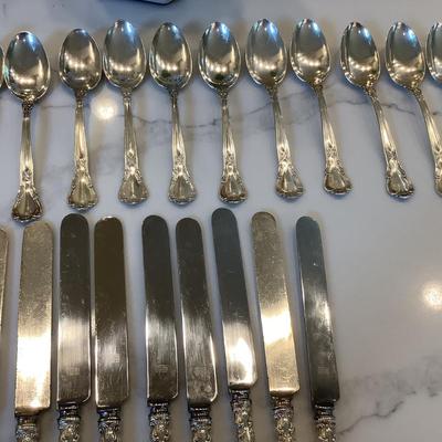 Silver- Essentials in Silver, 10 dinner knives, 12 forks, 10 spoons, 10 salad forks, 11 soup spoons