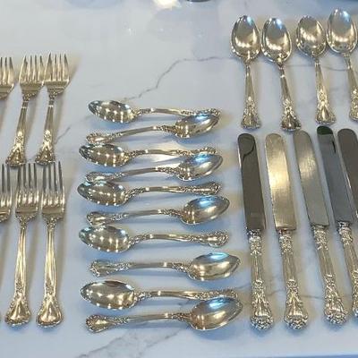 Silver- Essentials in Silver, 10 dinner knives, 12 forks, 10 spoons, 10 salad forks, 11 soup spoons