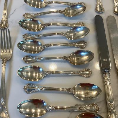 Silver- Essentials in Silver, 10 dinner knives, 12 forks, 10 spoons, 10 salad forks, 11 soup spoons