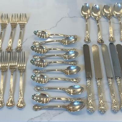 Silver- Essentials in Silver, 10 dinner knives, 12 forks, 10 spoons, 10 salad forks, 11 soup spoons