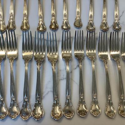 Silver- Essentials in Silver, 10 dinner knives, 12 forks, 10 spoons, 10 salad forks, 11 soup spoons