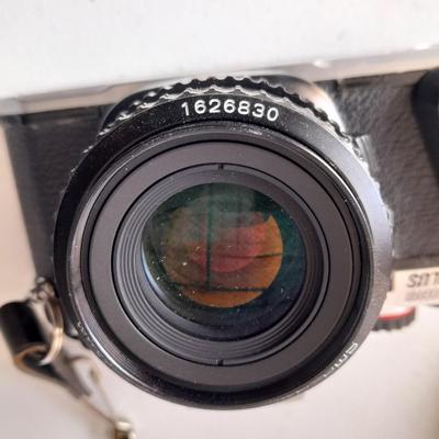 Vintage Pentax 35 MMM camera with flash and accessories