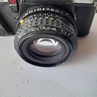 Vintage Pentax 35 MMM camera with flash and accessories